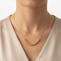 Girocollo sfere martellate Mille Luci oro giallo 18kt 40-45cm indossato